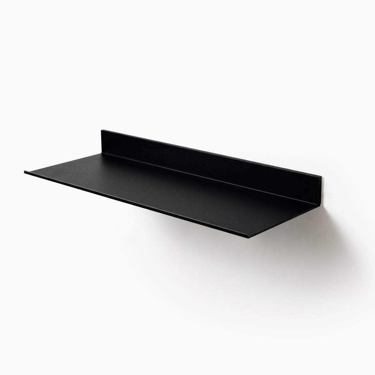 Black aluminum floating display shelf with concealed wall mounting, studio product view