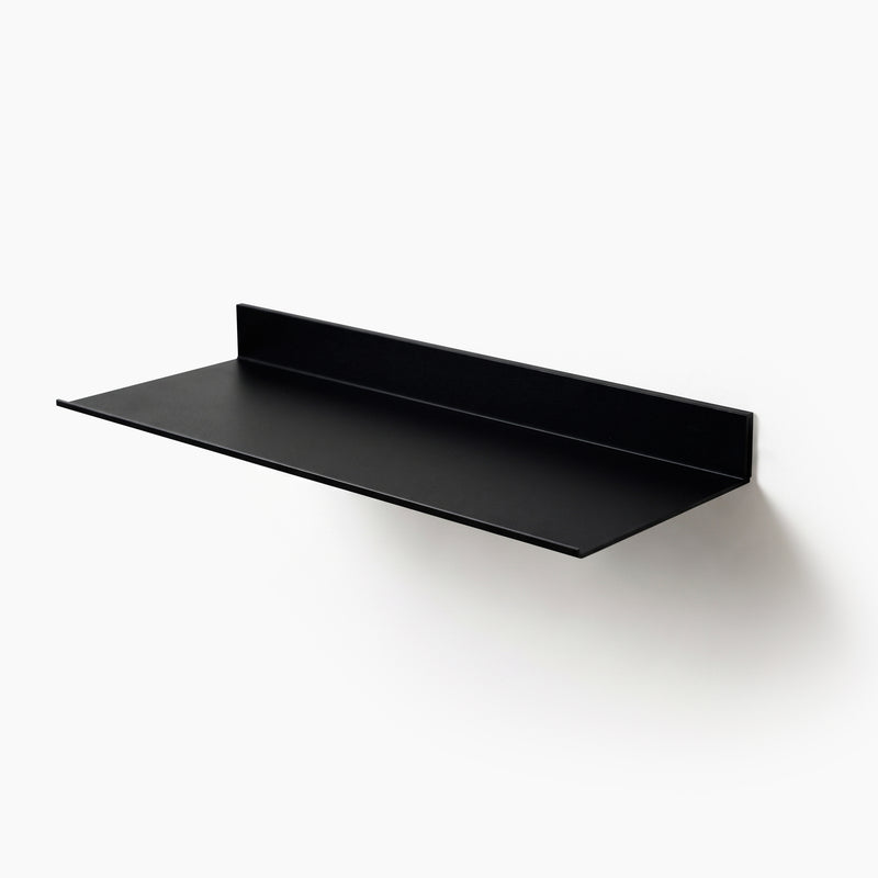 Black aluminum floating display shelf with concealed wall mounting, studio product view