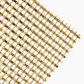 Close-up of decorative wire mesh panel WG0007 showing flat and round wires interlocked in a warm-toned metal finish